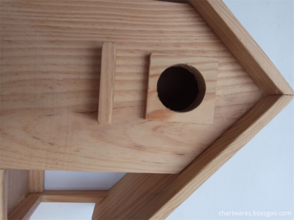 wooden bird house standing