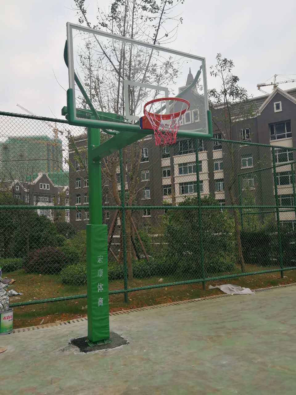 Fixed single-arm basketball hoops