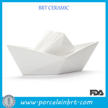 White ceramic boat shaped napkin holder