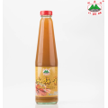 Plum sauce in a glass bottle