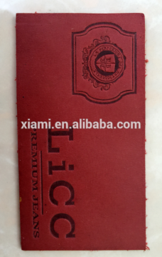 wholesale bright red debossed cool logo top layer leather label maker