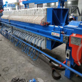Automatic plate and frame sludge dewatering filter press