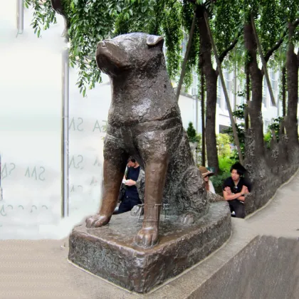 Antique cast bronze metal copper akita dog statue sculpture