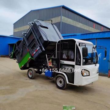 Camion de déchets montés sur latéraux à quatre roues électriques