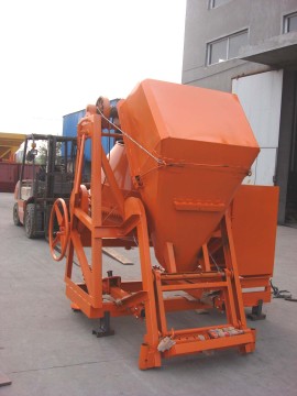 Bucket feed concrete mixer