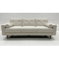 Light colored fabric three person sofa