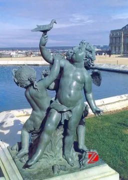 Bronze angel statues playing a bird