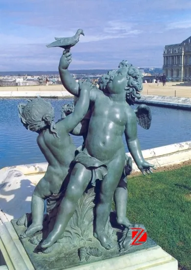 Bronze angel statues playing a bird