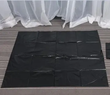 Large Black Garbage Bag on Sheet