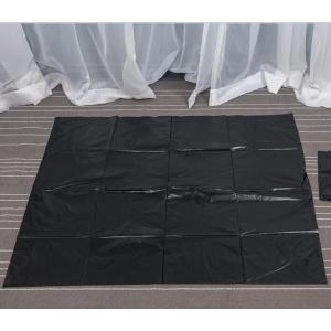 Large Black Garbage Bag on Sheet