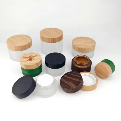Frosted green cosmetic glass jar with bamboo lid