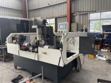 Multi-axis tapping and drilling machine