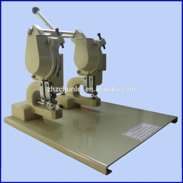 Semi-automatic two head eyelet punch machine