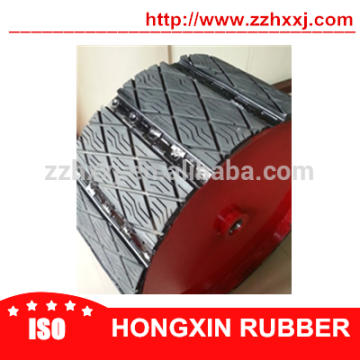 Conveyor pulley lagging traction pads