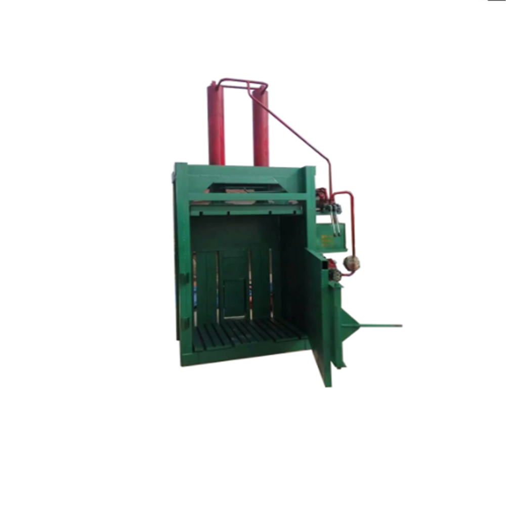 Waste paperboard baler machine
