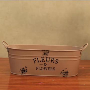 Retro made old iron flower arrangement bucket