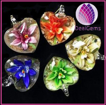 Pendant, lampworked glass, multi-colored with copper-colored foil, 40x32mm single-sided domed round with flower design
