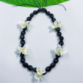 Noix de kukui acrylique divisée par collier de bougainvillea lei