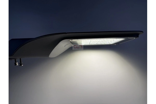 modern LED street light pole installation on urban road at night