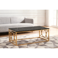 Mesa de centro con diseño de mármol negro y marco dorado