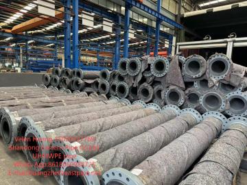 Steel pipe lined with UHMW-PE pipe
