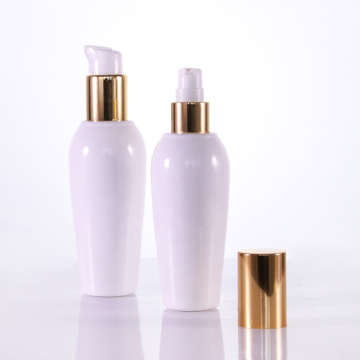 Runde Formlotion Flasche mit goldenen Kappen