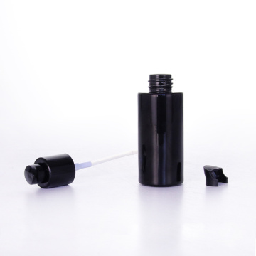 Botella de loción de vidrio negro con tapas de bomba