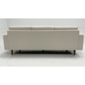Light colored fabric three person sofa