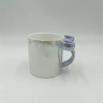 White Ceramic Mug with Blue Handle