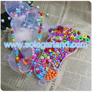 Boîte à bijoux en plastique transparent de forme de pied de bébé avec 12 petits organisateurs de conteneur de stockage de perles de pilule