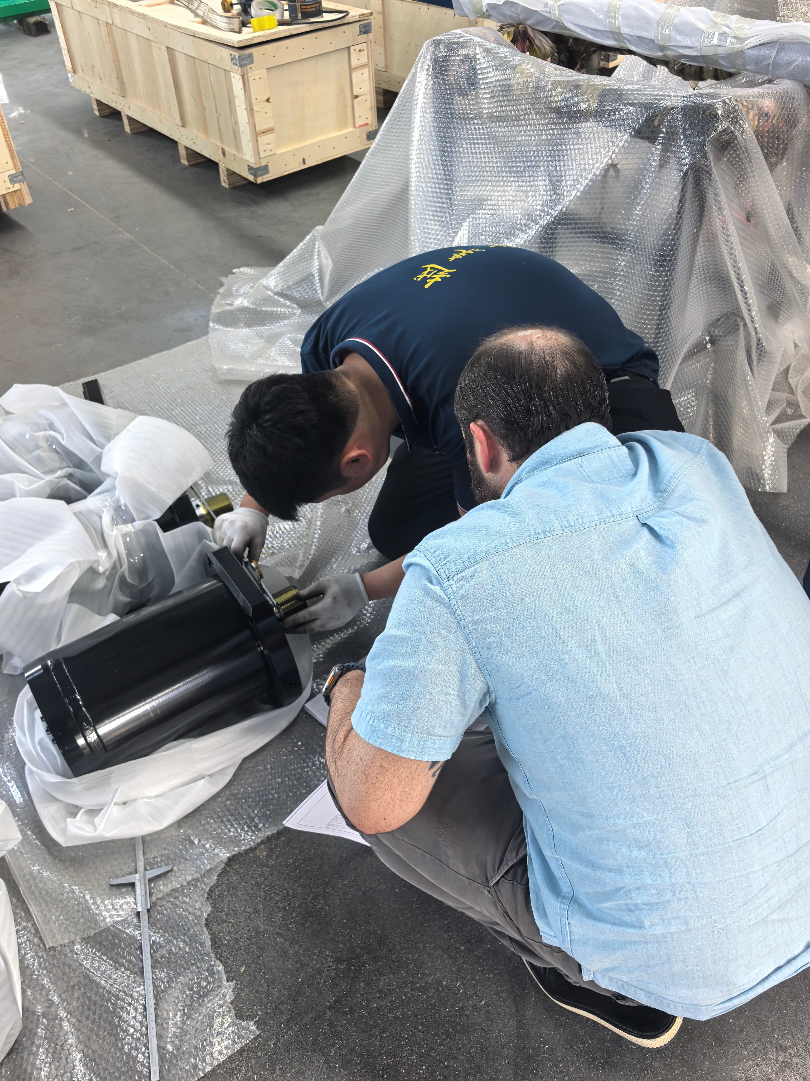 Guoyue Hydraulics engineers performing on-site measurement and performance testing of 200mm bore cylinder for Brazil tire plant client.