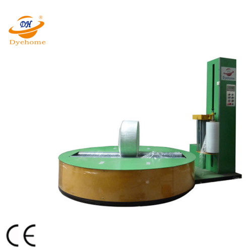 Non-woven paper roll pallet wrapping machine