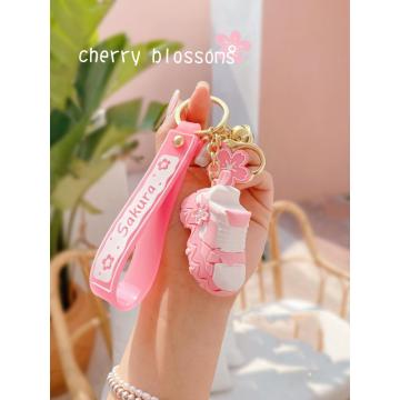 Porte-clés en PVC avec chaussures en fleurs de cerisier