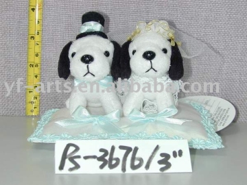 Wedding dogs standing at a cushion