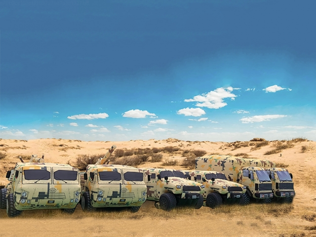 Convoy of inflatable military vehicle decoys assembled in the desert