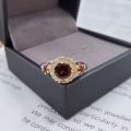 Ring set with garnets in white gold