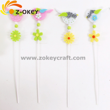 Different colorful bird felt crafts with a stick for home decorative