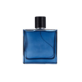 Garrafa de perfume de vidro azul com tampa da bomba