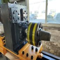 Versatile Excavator modified into down-the-hole drill