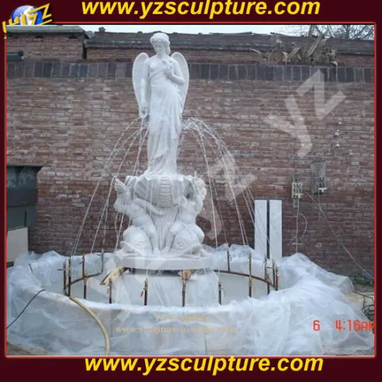 outdoor carved white stone water fountain sculpture with large angel