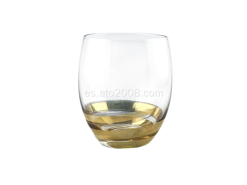 Vaso de vidrio transparente con base dorada