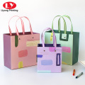Clothing gift shopping paper bags with ribbon