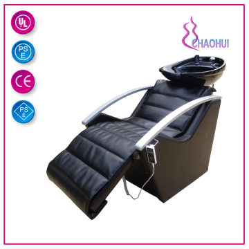 Comfortable electric shampoo chair in salon