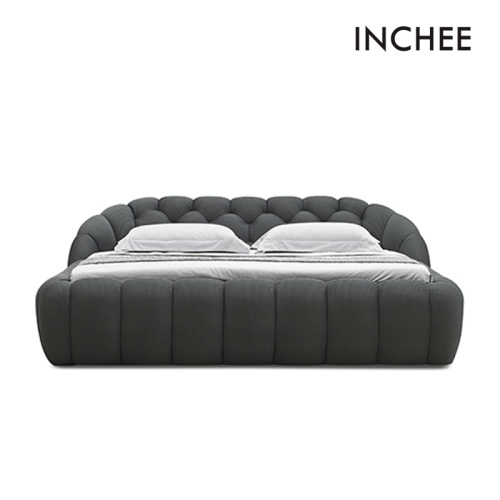 黒い布張りの柔らかい現代ベッド