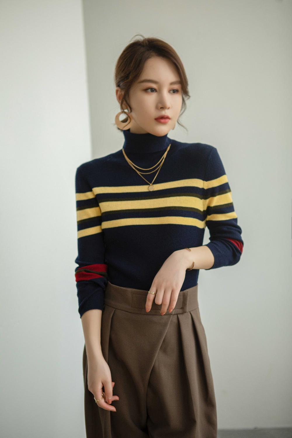 Women's blouse with a high collar and stripes