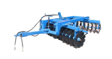 Disc ploughs harrows farmland Tractor
