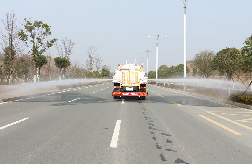 water spray truck in action 3