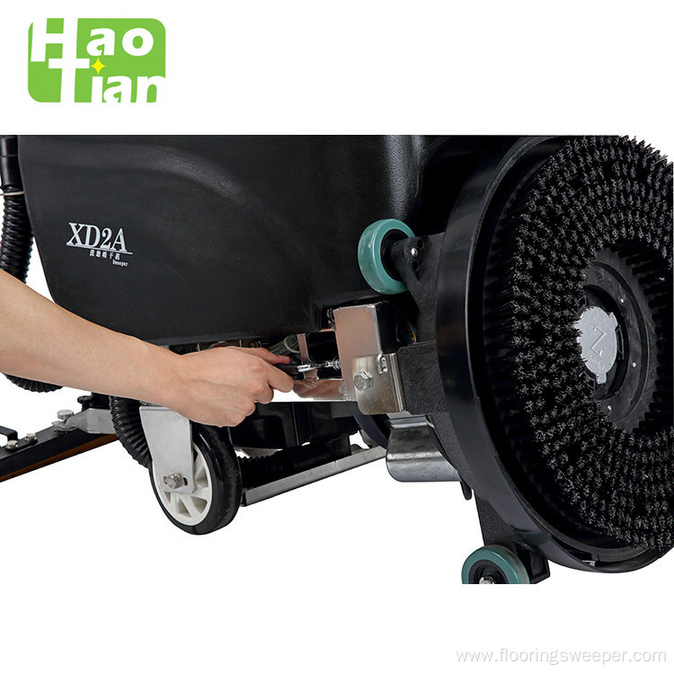 Cable powered hand floor scrubber