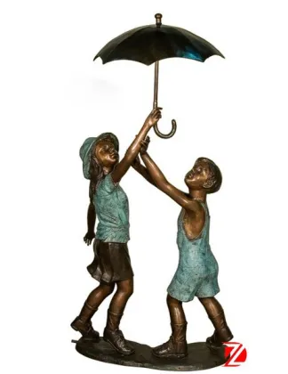 bronze boy and girl statues holding umbrella