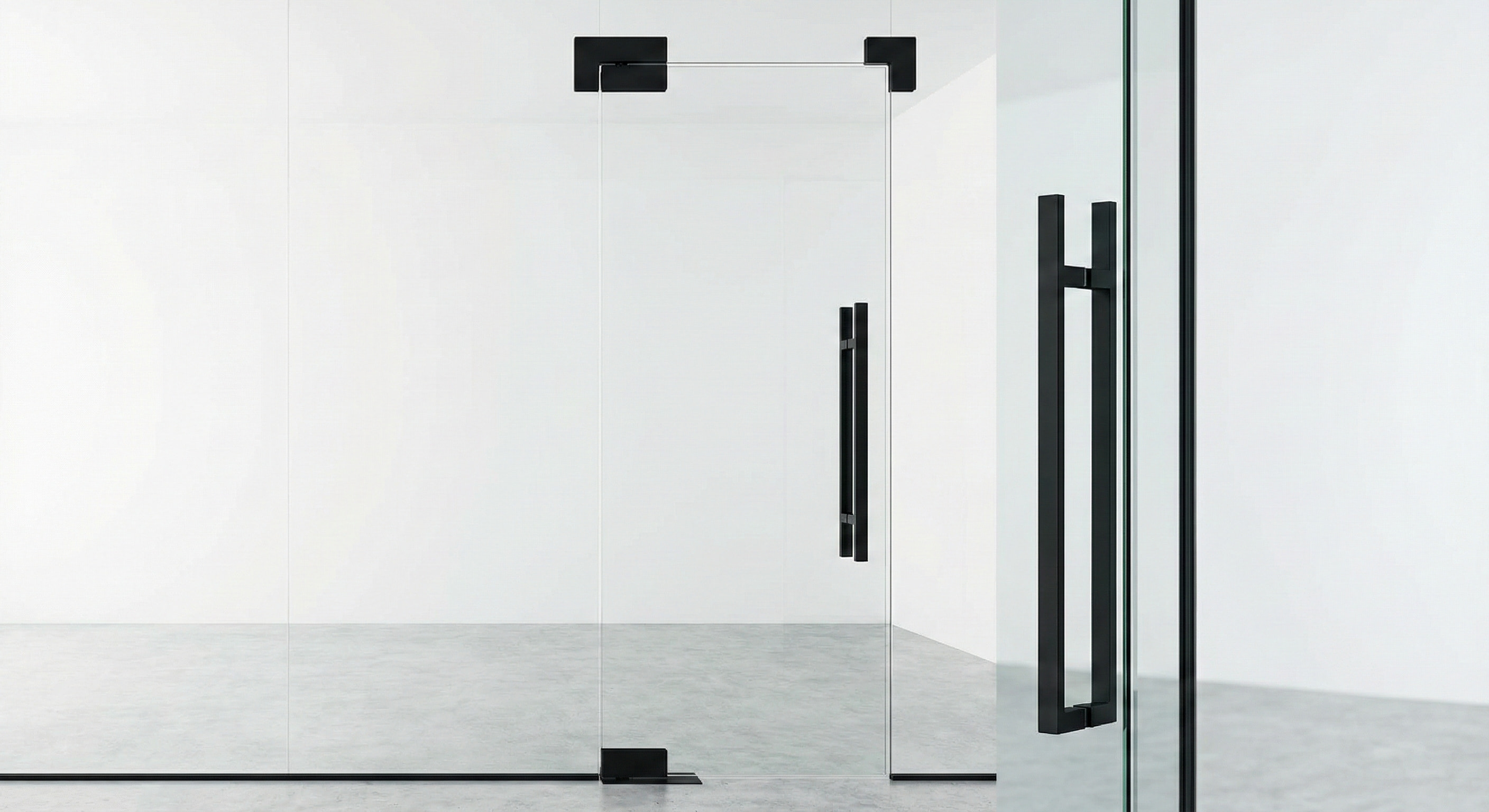 Matte black stainless steel glass door patch fittings in a modern minimalist office